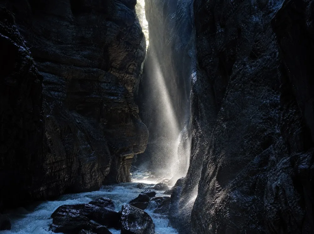 A shaft of sunlight falling through the opening of a gorge